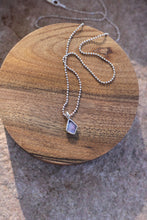 Load image into Gallery viewer, Necklace with a opal pendant on a wooden surface