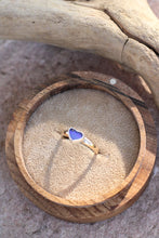 Load image into Gallery viewer, Ring with a heart-shaped opal stone in a wooden box on sand