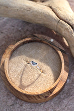 Load image into Gallery viewer, Heart-shaped ring on a wooden box with natural light