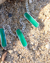 Load image into Gallery viewer, Green stone necklaces with silver chains on a sandy surface