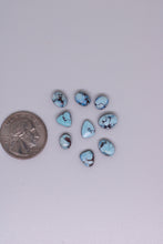 Load image into Gallery viewer, Turquoise stones with a quarter for scale on a light gray background
