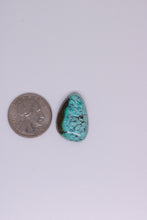 Load image into Gallery viewer, Turquoise stone next to a quarter on a white background
