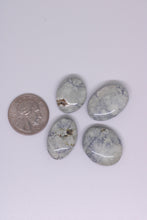 Load image into Gallery viewer, Four oval-shaped stones with a quarter for scale on a white background
