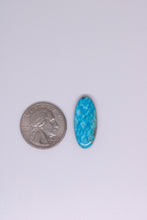 Load image into Gallery viewer, Turquoise stone next to a U.S. quarter on a white background
