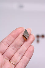 Load image into Gallery viewer, Hand holding a small jasper stone against a blurred background
