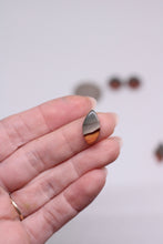 Load image into Gallery viewer, jasper stone held between fingers against a neutral background
